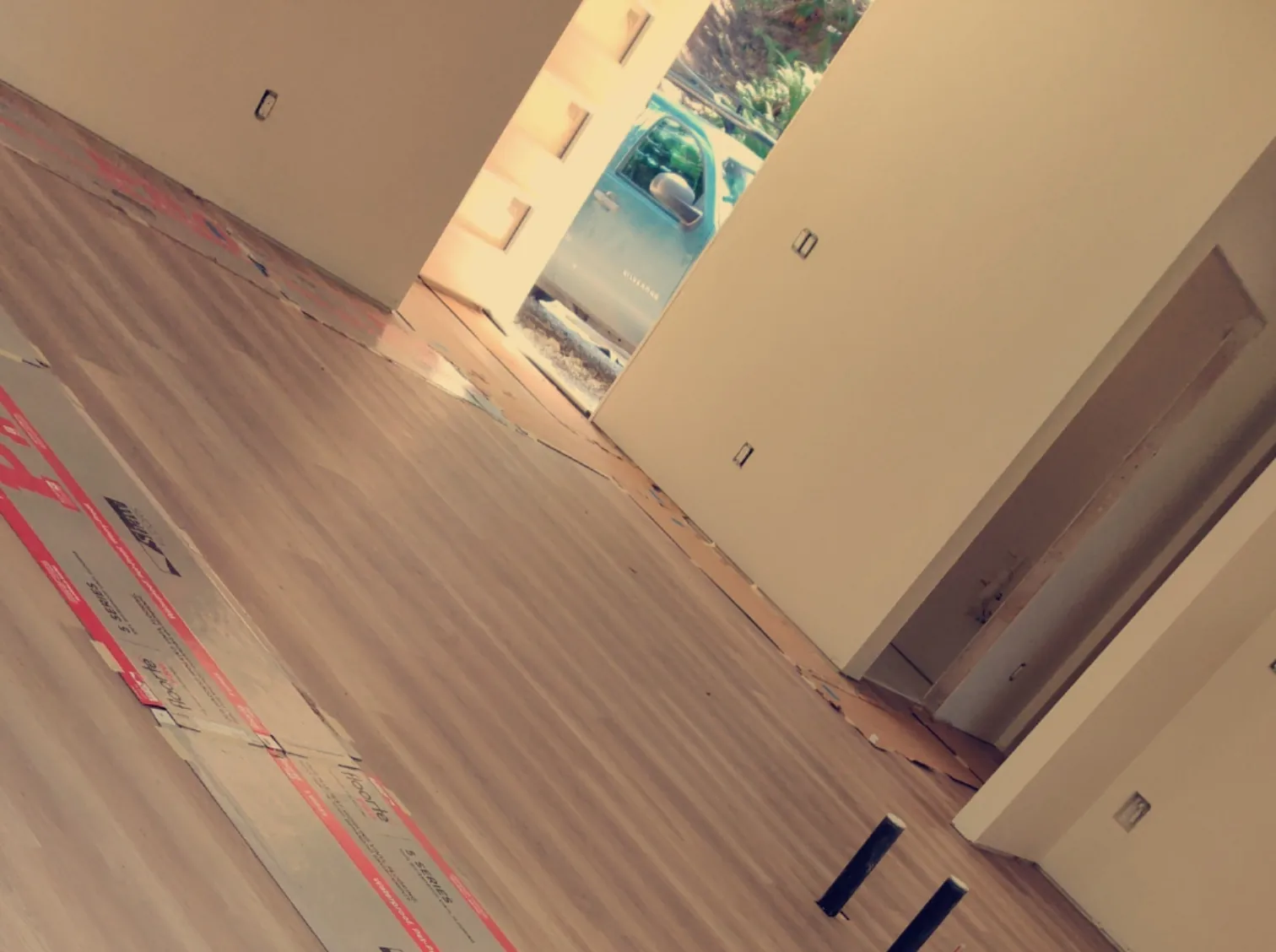 Wood-look plank flooring installed during an open residential interior renovation