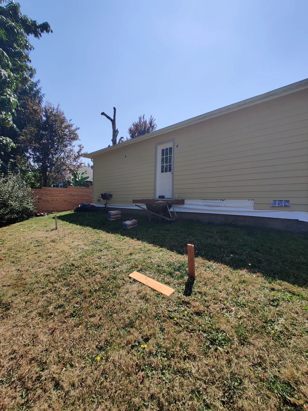 Exterior lap siding progressing along a residential addition or remodeled structure